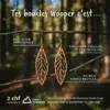 Affiche marketing Wooper présentant les avantages des boucles d'oreilles Ekinox : acier inoxydable, diffuseur d'huiles essentielles, bois suisse recyclé avec engagement environnemental Summit Foundation