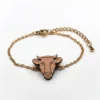 Bracelet en bois animal vache doré